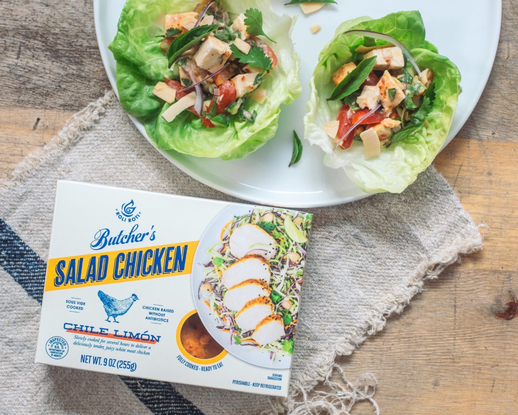 Coconut Chicken Lettuce Cups on a plate next to a package of chicken